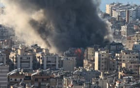 Smoke plumes billow following Israeli bombardment on Beirut's southern suburbs on March 2, 2026. The war launched by the United States and Israel against Iran spread across the Middle East on March 2 with Lebanon's Hezbollah entering the fray and a British air base in Cyprus targeted.