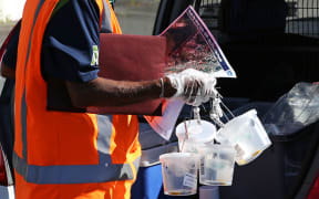 Ministryfor Primary Industries contractor about to set fruit fly traps in Grey Lynn, Auckland.