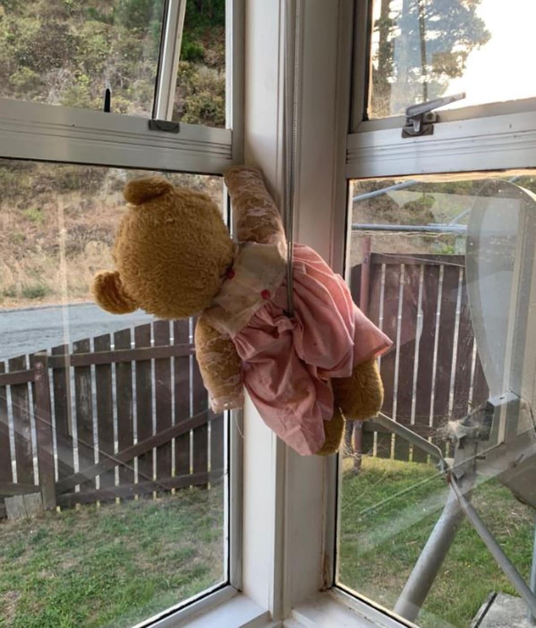 People are putting teddy bears in their windows for kids to see as they walk past.