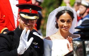 Meghan, Duchess of Sussex begins her carriage procession with Britain's Prince Harry, Duke of Sussex in the Ascot Landau Carriage after their wedding ceremony at St George's Chapel, Windsor Castle, in Windsor, on May 19, 2018.  / AFP PHOTO / POOL / CHRIS JACKSON
