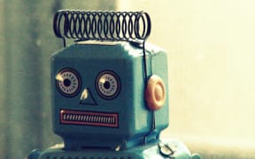 A 1950s toy robot, photographed is a close up of its head.