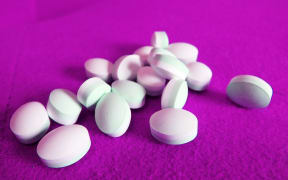 Tablets isolated in a purple background