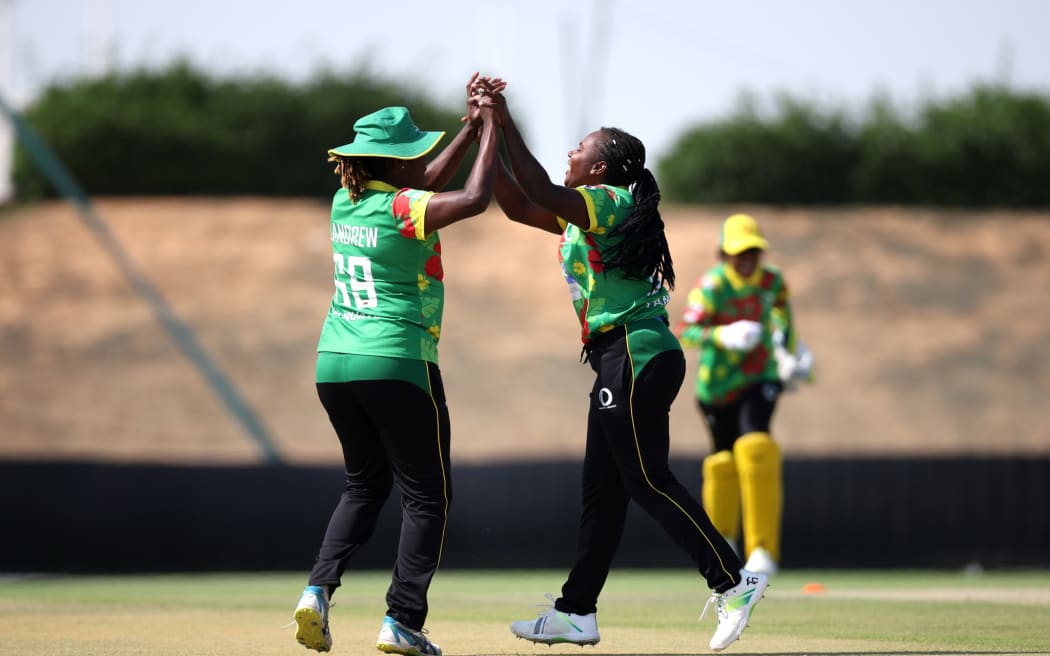ABU DHABI, UNITED ARAB EMIRATES - APRIL 27: Selina Solman and Rachel Andrew of Vanuatu celebrate after bowling Heather Siegers of Netherlands during the ICC Women's T20 World Cup Qualifier 2024 match between Vanuatu and Netherlands at Tolerance Oval on April 27, 2024 in Abu Dhabi, United Arab Emirates. (Photo by Neville Hopwood-ICC/ICC via Getty Images) (Photo by Neville Hopwood-ICC/ICC via Getty Images)