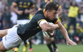 The Springboks Handre Pollard dives for a try.