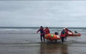 Members of the Otago Surf Life Saving SAR team, of Dunedin, end their day's search.