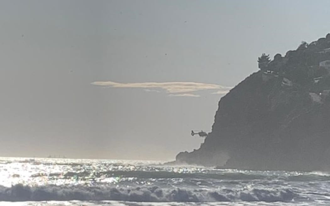A helicopter rescuing a surfer at Sumner Beach, Christchurch on 13 September, 2022.