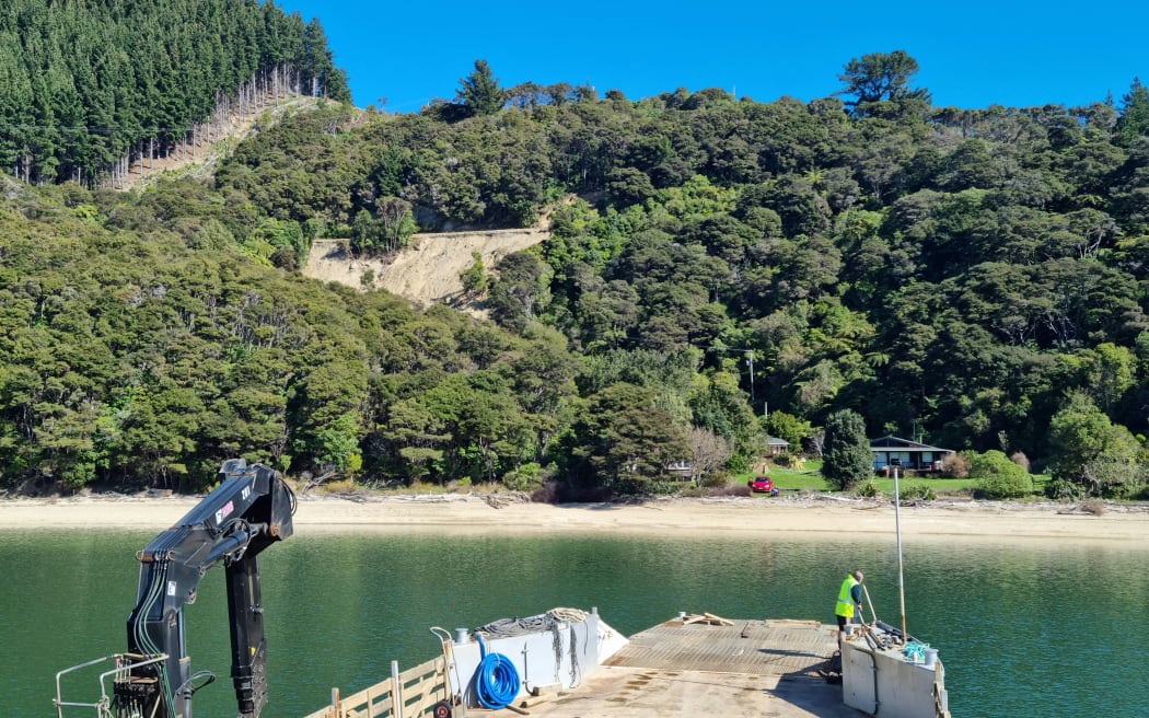 A huge slip on the Kenepuru Road, visible behind Chrissy Sumby's Waima Bay property.