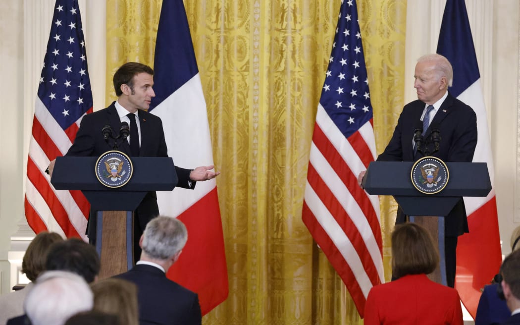 US President Joe Biden and French President Emmanuel Macron hold a joint press conference in the East Room of the White House in Washington, DC, on December 1, 2022.