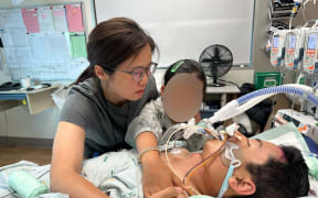 Jun Jiang, who is injured from a fall, is now in coma in the hospital.