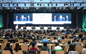COP29 President Mukhtar Babayev speaks at a first closing plenary of the COP29 Climate Conference in Baku on November 23, 2024. - The Azerbaijani head of COP29 urged nations on November 23, to bridge their differences after two weeks of fraught negotiations at the UN climate talks over money to help poorer countries tackle global warming. (Photo by STRINGER / AFP)
