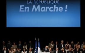 French Interior Minister and Lyon's mayor Gerard Collomb delivers a speech during a meeting of candidates of "La Republique en marche" party in the Rhone for the upcoming parliamentary election (elections legislatives) in Lyon, on June 7, 2017. / AFP PHOTO / JEFF PACHOUD
