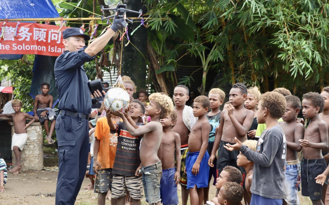 A China Police Liaison Team engages with Koa Hill community in the Solomon Islands in July. The Chinese and Solomon Islands Police teams engaged more than 200 community members with 30 different teams during a sport activity. known as the China-Solomon Island (SI) Friendship Cup.