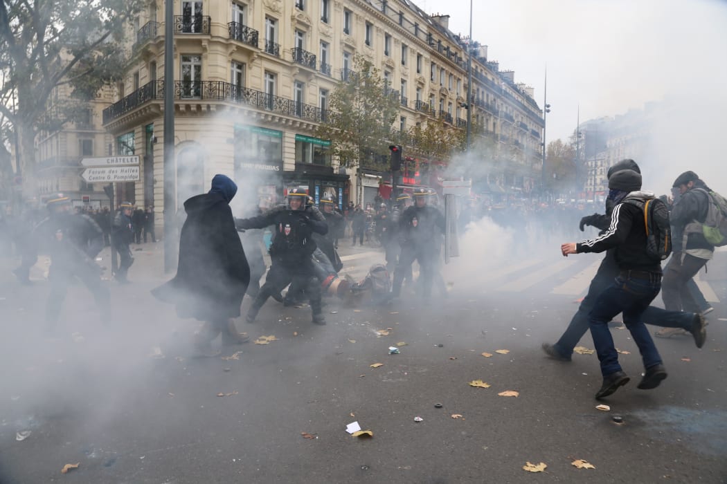 Police fired tear gas at demonstrators in Paris.