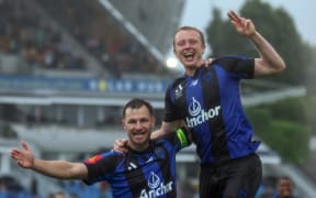 Auckland FC's Francis de Vries celebrates his goal with Tommy Smith.