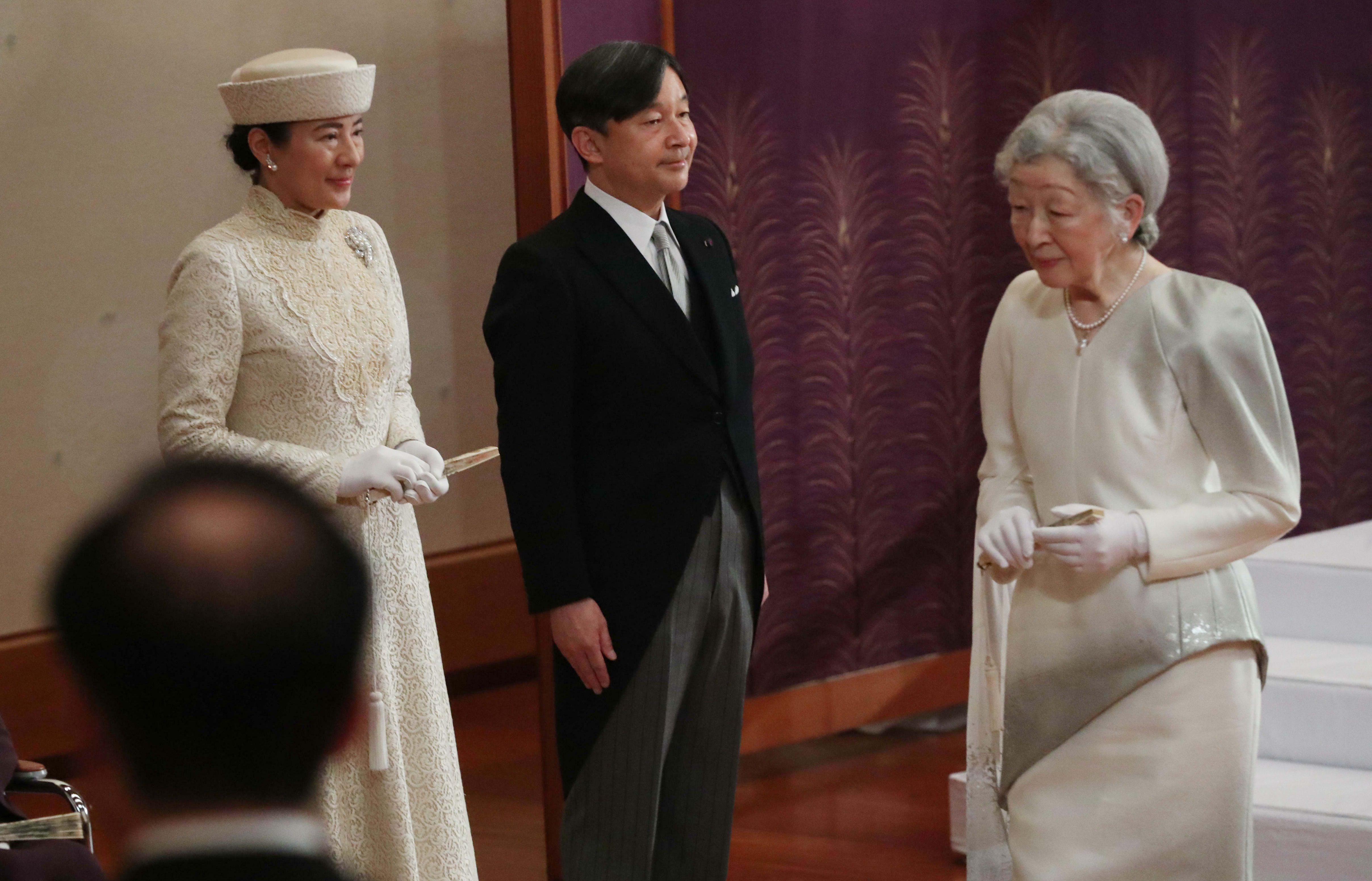Japan's Crown Prince Naruhito and Crown Princess Masako, left, prepare to leave following Empress Michiko after the ceremony of Emperor Akihito's abdication at the Imperial Palace in Tokyo on 30 April, 2019.