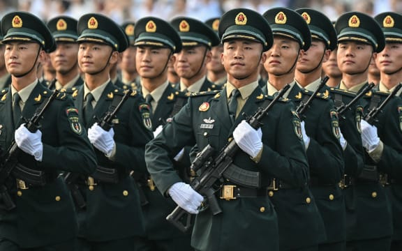 Chinese soldiers take part in a rehearsal hours before a military parade marking the 80th anniversary of victory over Japan and the end of World War II, in Beijing’s Tiananmen Square on 3 September, 2025.