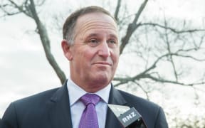 Prime Minister John Key talking to media outside Rainbows End. 16 June 2016.