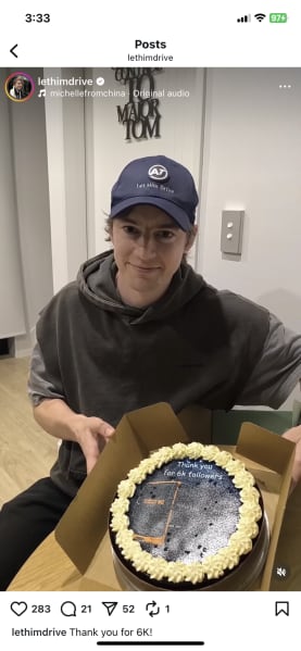 A picture shows Robert Richards holding a cake, with bus NX2 printed on it