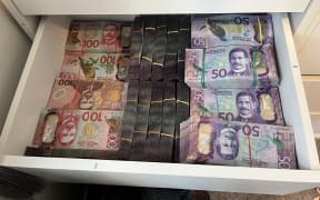 Cash located during search warrants as part of Operation Solana.