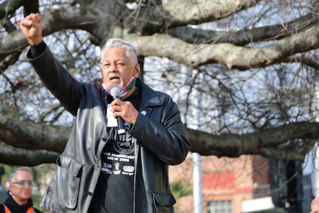 Will 'Ilolahia of the Polynesian Panthers raises his fist along with protesters as he speaks at the Black Lives Matter rally in Auckland's Aotea Square on 14 June, 2020.