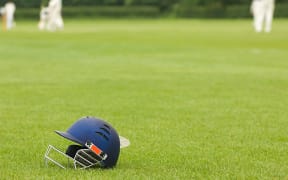 Cricket helmet on a cricket ground (Photo by Harris Artemis / Connect Images via AFP)