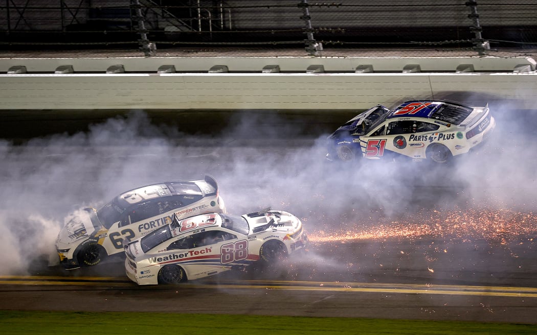 Shane van Gisbergen's No 88 Chevrolet, centre, Anthony Alfredo's No 62 Chevrolet, left, and Cody Ware's Ford spin after an incident in the Nascar Cup Series Duel 2 at Daytona International Speedway, 13 Feb, 2025.