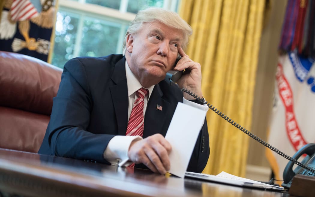 US President Donald Trump makes a phone call.