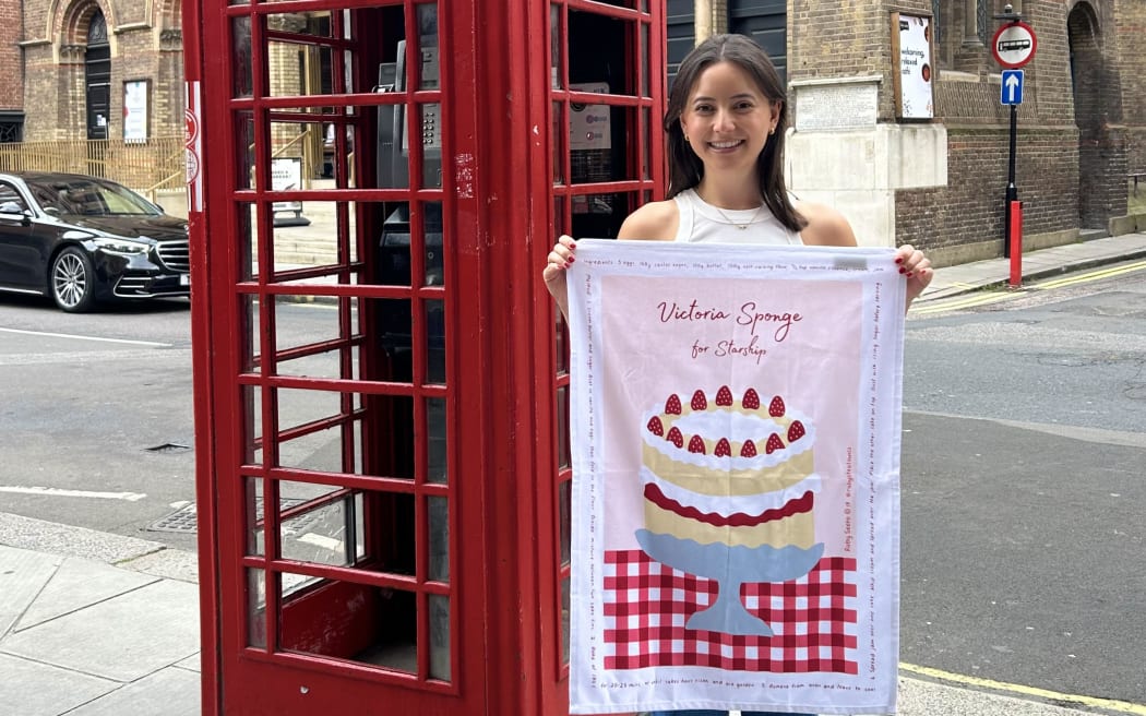 Ruby Seeto with her 'Victoria Sponge for Starship' tea towel.