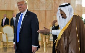 US President Donald Trump and Saudi Arabia's King Salman bin Abdulaziz al-Saud stop for coffee in the terminal of King Khalid International Airport following Trump's arrival in Riyadh.