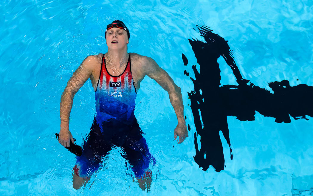 An overview shows US' Katie Ledecky reacting after winning the final of the women's 800m freestyle swimming event during the Paris 2024 Olympic Games at the Paris La Defense Arena in Nanterre, west of Paris, on August 3, 2024. (Photo by François-Xavier MARIT / AFP)