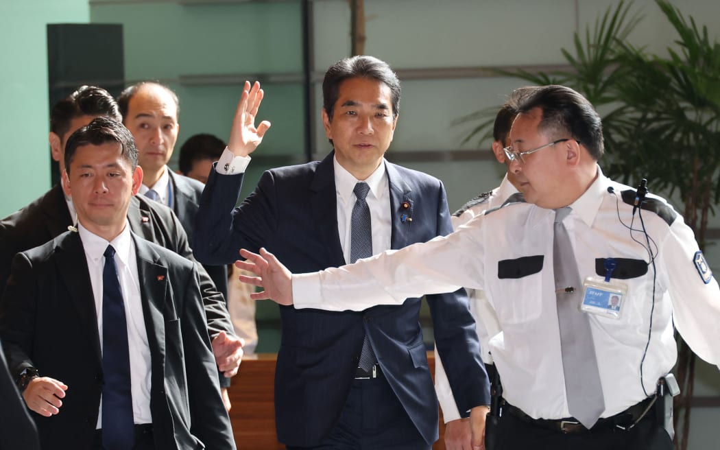 Taku ETO, Japanese Minister of Agriculture, Forestry, and Fisheries (C), arrives at the Prime Minister's office in Tokyo, Japan, on May 21, 2025. He submitted his resignation letter to Prime Minister Shigeru ISHIBA following his gaffe during a speech at a Liberal Democratic Party meeting held in Saga City, Kyushu Region, on May 19. he said that he had never bought rice because supporters had given him such a large amount that he could sell. ( The Yomiuri Shimbun ) (Photo by Masamine KAWAGUCHI / Yomiuri / The Yomiuri Shimbun via AFP)