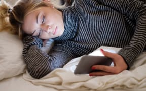 89247445 - teenage girl victim of bullying reading text message