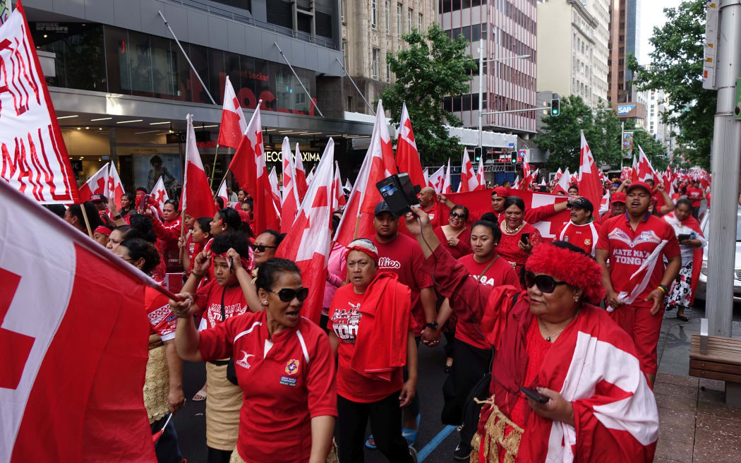 Tongan fans march down Queen Street after the loss to England in the rugby League World Cup semi-final.
