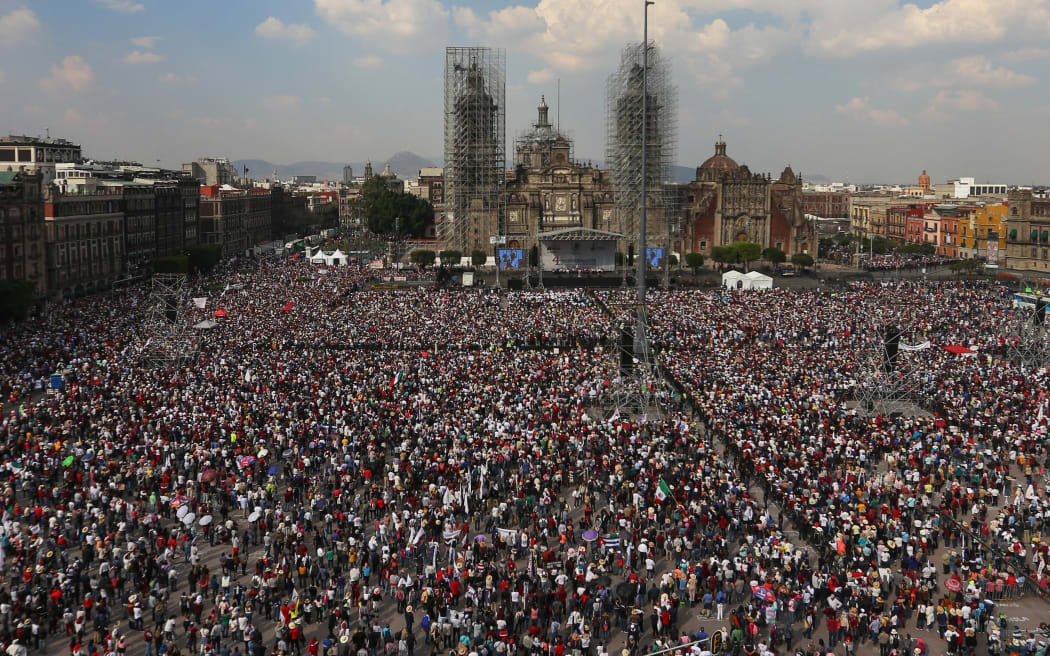 Aerial view of the Zocalo square during the commemoration of Mexican President Andres Manuel Lopez Obrador's fourth year in office, in Mexico City, on November 27, 2022. (Photo by RODRIGO OROPEZA / AFP)