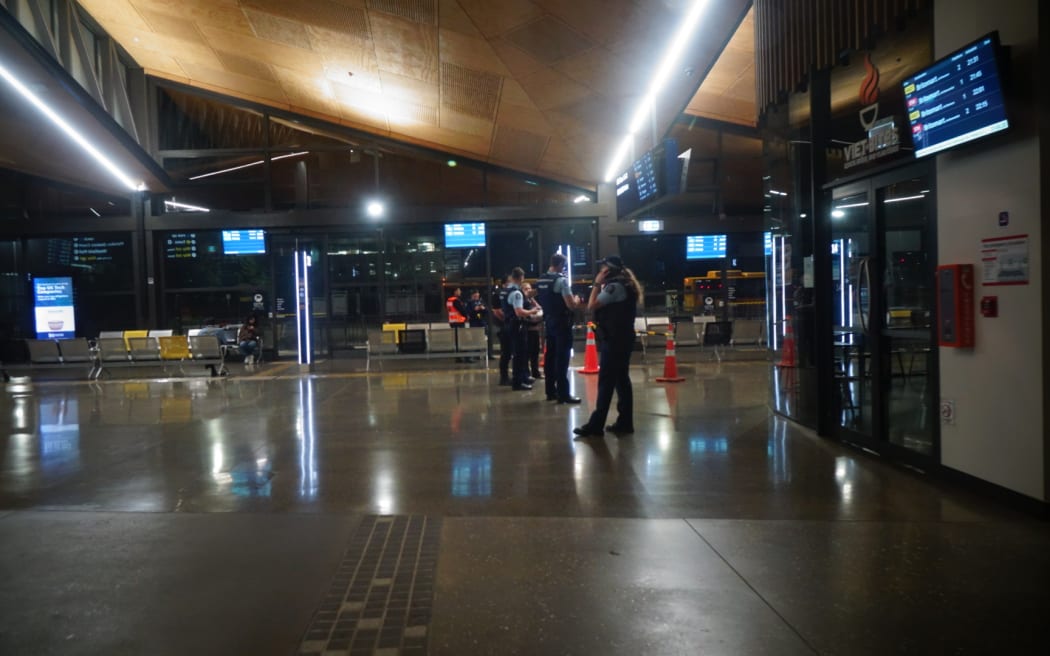 Police at the scene of an assault at a bus station in Manukau.