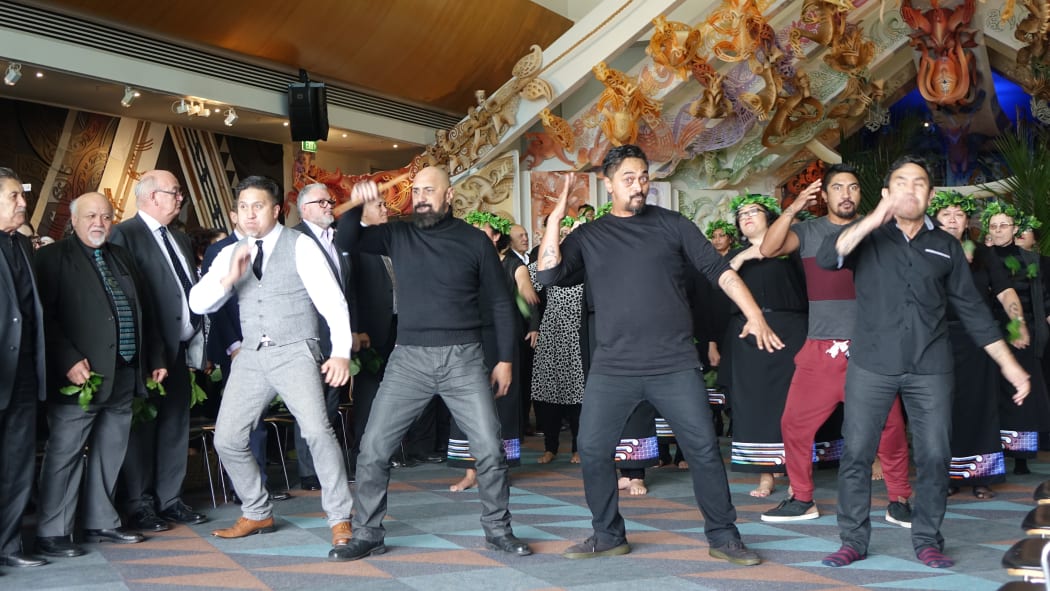 A haka pōwhiri is performed to welcome the remains to Te Papa's marae.