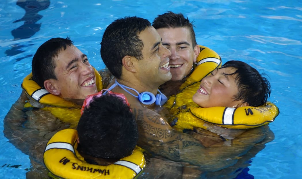 Learning survival skills at Waipukurau swimming pool.