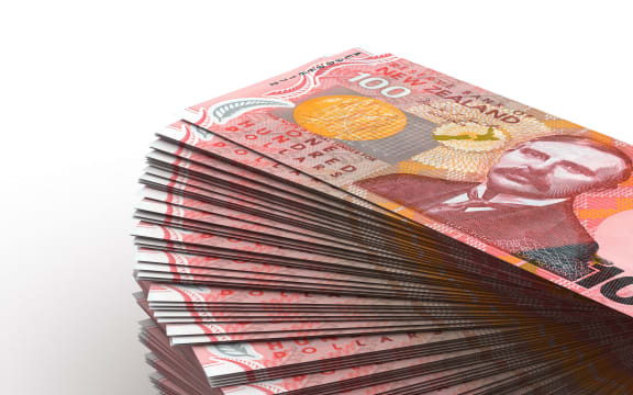A stack of NZ $100 bills.