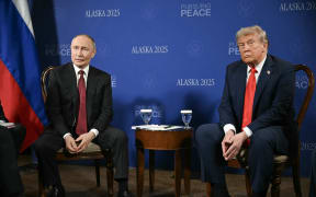 US President Donald Trump and Russian President Vladimir Putin meet during a US-Russia summit on Ukraine at Joint Base Elmendorf-Richardson in Anchorage, Alaska, on August 15, 2025. US President Donald Trump and his Russian counterpart Vladimir Putin shook hands and exchanged greetings Friday as they arrived at a military base in Alaska for a historic summit on Moscow's war in Ukraine.
