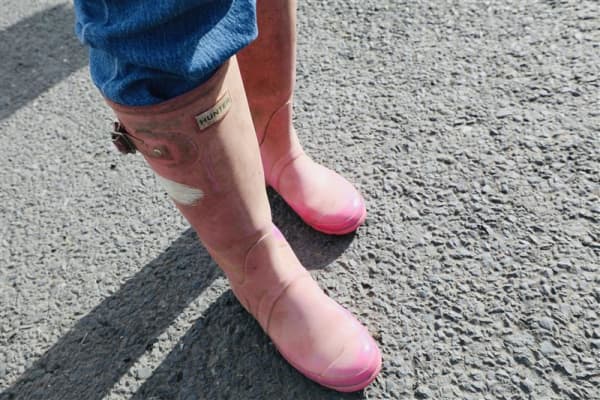 Mary from France is wearing gum boots she got from an op shop at Fieldays, on 11 June, 2025.