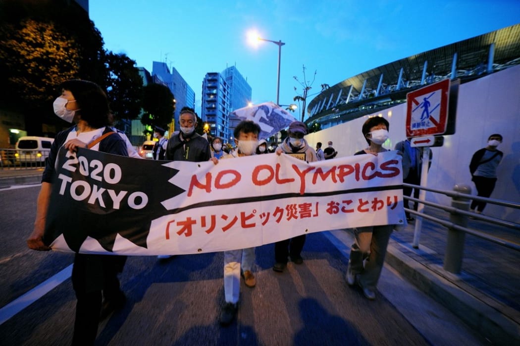 TOKYO, JAPAN - MAY 09: People stage a demonstration as they demand Tokyo Olympics to cancelled due to coronavirus pandemic in Tokyo, Japan on May 9, 2021.
