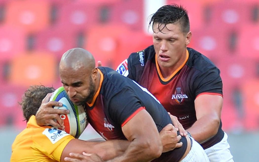 Waylon Murray (c) of the Kings takes the tackle.