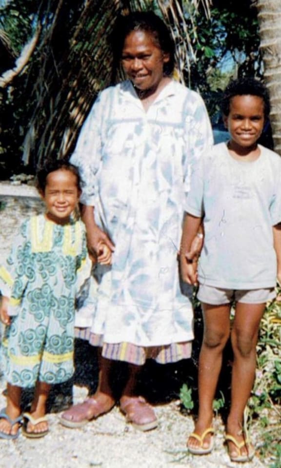 Jessie Ounei (left), her mum Susanna Ounei, and her brother Toui Jymmy Jinsokuna Burēdo Ounei in Ouvéa, New Caledonia. Credit: Supplied