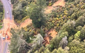 Contractors clearing a slip from State Highway 6 near Murchison.