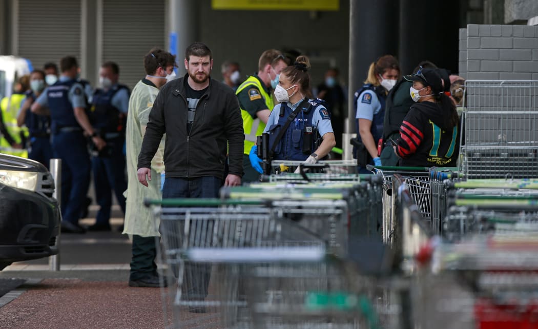 Ross Tomlinson outside LynnMall being spoken to by a police officer on the day of the terror attack.