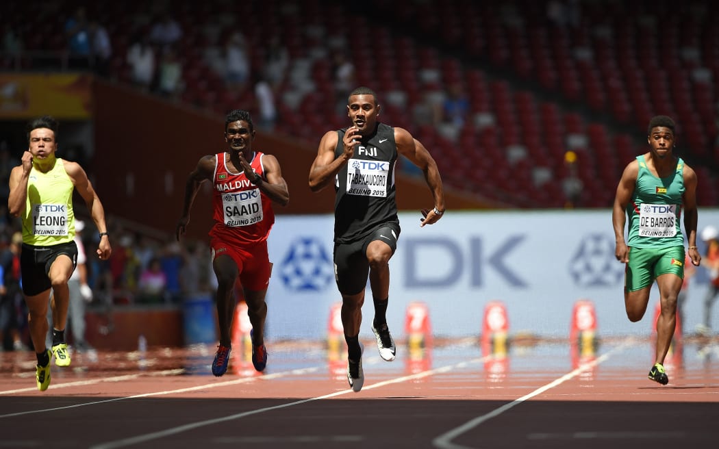 (L-R) Macau's Leong Wang Kuong, Maldives' Hassan Saaid, Fiji's Ratu Banuve Tabakaucoro and Sao Tome's Joao De Barros compete in the preliminary round of the men’s 100 metres athletics event at the 2015 IAAF World Championships at the "Bird's Nest" National Stadium in Beijing on August 22, 2015.  AFP PHOTO / OLIVIER MORIN (Photo by OLIVIER MORIN / AFP)