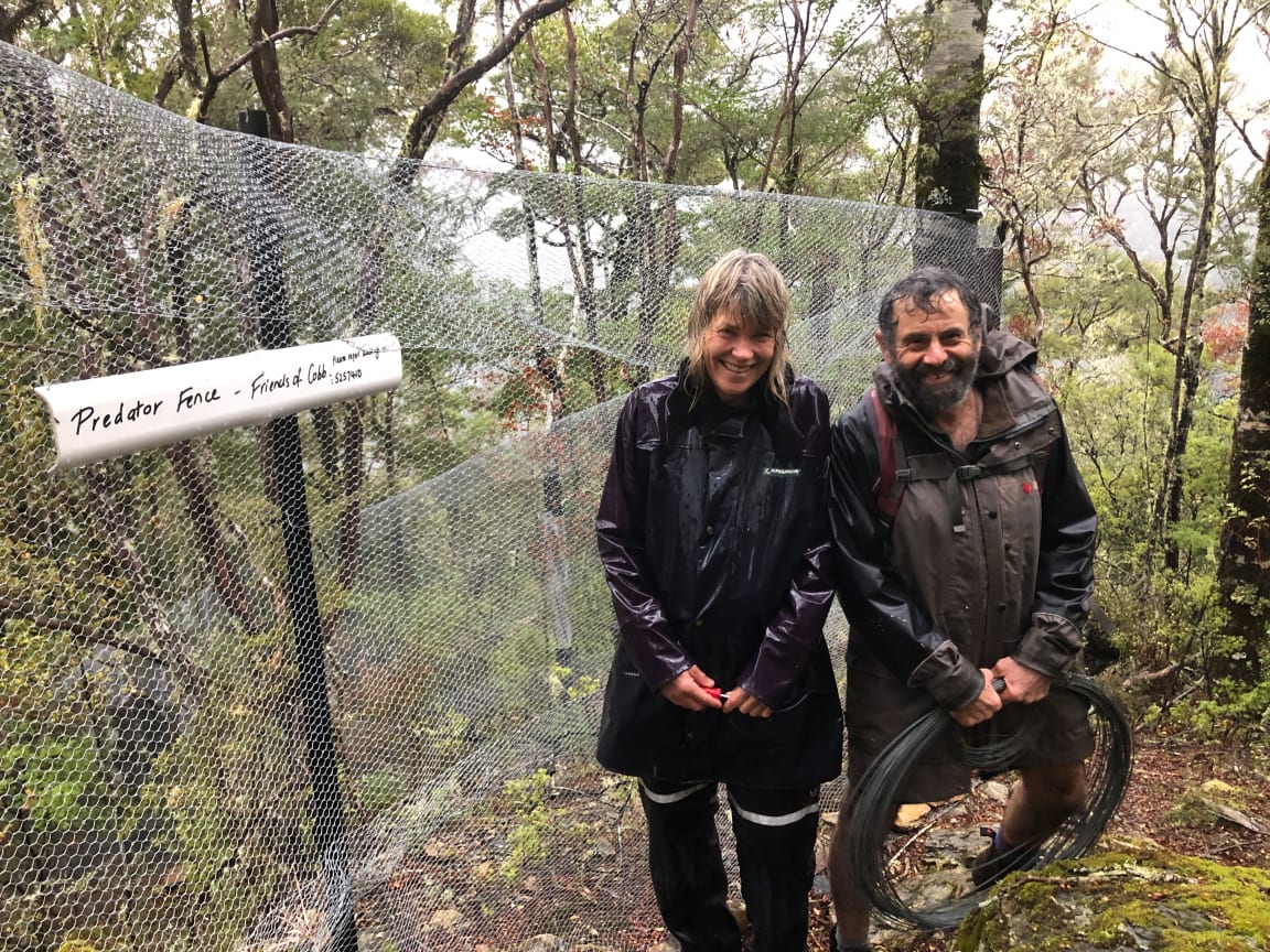 Nina Visker and Richard Stocker outside recently constructed predator exclusion fence, Cobb Valley, Upper Takaka