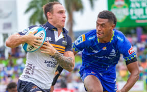 Corey Toole runs with the ball during round one Super Rugby Pacific match between Fijian Drua and ACT Brumbies at HFC Stadium.