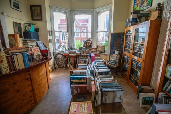 Stacks of books on tables and shelves at Hard to find Books store, Eden Terrace.