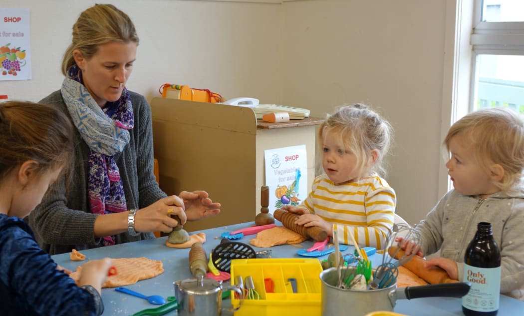 Charlotte Williams and her daughters play with playdough.